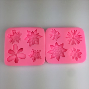 Daisy and sunflower silicone fondant molds in pink for DIY cake baking and chocolate