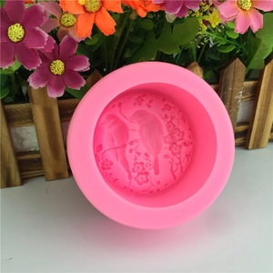 Pink silicone mold with bird and plum blossom relief for DIY cake decorating and soap making