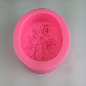 Pink rose silicone mold for DIY baking and cake decorating on light grey background