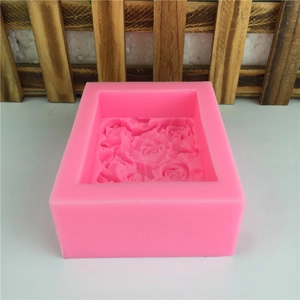 Pink rectangular silicone mold featuring detailed rose floral embossed patterns for baking