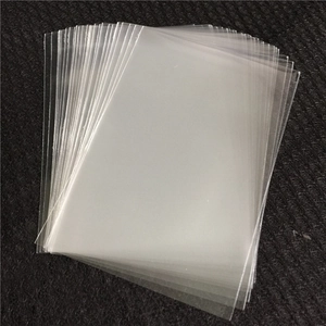 High transparency OPP lollipop packaging bags with golden twist ties on dark background
