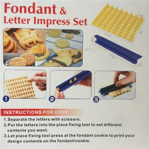 Alphabet cookie stamp set for baking including yellow letters and a blue holder tool