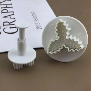 Detailed macro view of 3-leaf holly plunger cutters for DIY fondant and cookie baking