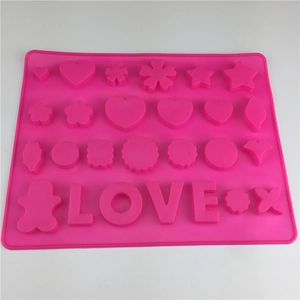 Pink silicone mold with heart, star, and LOVE letter shapes for chocolate and baking