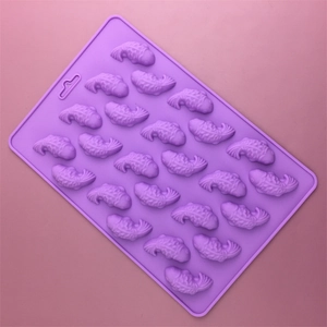 Purple silicone mold featuring 24 small koi fish cavities for DIY cake and chocolate baking
