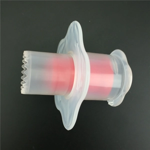 Plastic cupcake corer tool with red center and serrated edge for pastry hole making