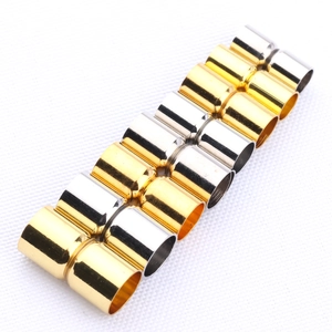 Close-up of polished gold and silver cylindrical magnetic clasps for DIY jewelry making