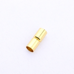 Close-up of golden magnetic cylinder clasp for DIY bracelet and necklace jewelry crafting