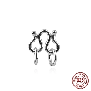 Macro view of S925 sterling silver S-shaped jewelry clasp connectors for DIY designs