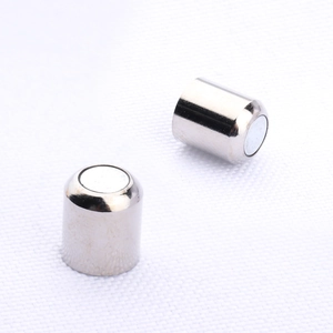 Detailed view of silver cylindrical magnetic clasps for DIY jewelry making and crafts