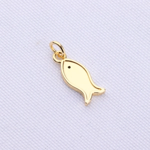 Detailed close-up of a golden fish pendant with smooth surface and black eye detail