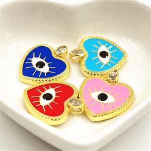 Macro detail of colorful enamel heart evil eye pendants with micro-set zircon accents