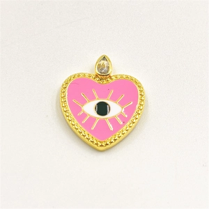 Detail of pink heart evil eye pendant with enamel finish and gold beaded edges