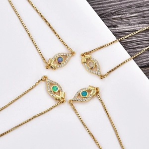 Golden box chain necklaces with opal evil eye pendants in four different colors