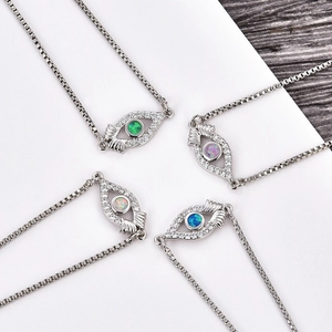 Silver evil eye charm bracelets with green, purple, opal and blue zircon center stones