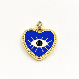 Detailed macro view of heart-shaped evil eye pendant with blue enamel and zircon