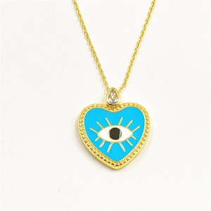 Detailed close-up of heart-shaped evil eye pendant necklace with blue enamel and zircon