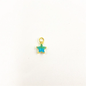 Detailed close-up of a star-shaped pendant with gradient blue zircon and golden metal loop