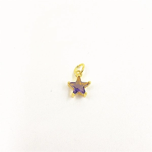 Macro shot of purple star-shaped pendant with cubic zirconia inlay and gold metal hook