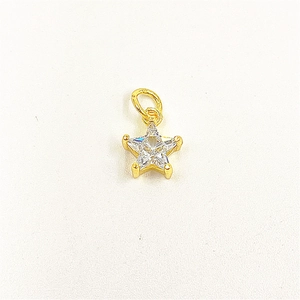 Detailed view of a gold star-shaped pendant with a clear five-pointed zircon inlay