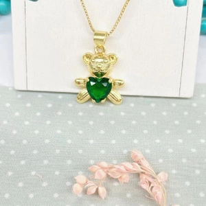 Golden teddy bear necklace with green heart zircon pendant on a delicate box chain