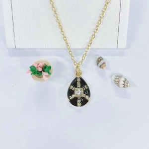 Golden drop pendant necklace with black enamel and sparkling square zircon stone