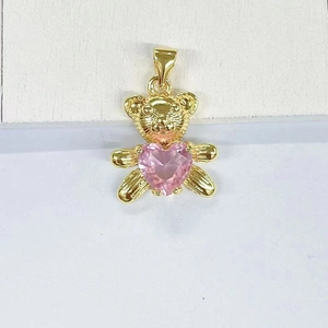 Detailed view of panda pendant with pink heart crystal in gold finish metal
