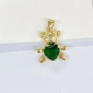 Close-up of golden panda pendant featuring a green heart-shaped zirconia stone