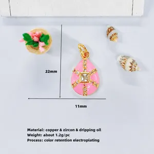 Detail of pink drop pendant with gold plating, zircon inlay and size 22mm x 11mm