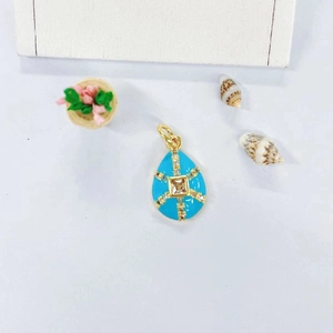 Detail of teardrop pendant with sky blue enamel and micro-set cubic zirconia in gold plating