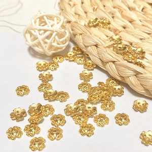 Detail of 18k gold plated hollow flower bead caps for DIY jewelry making accessories