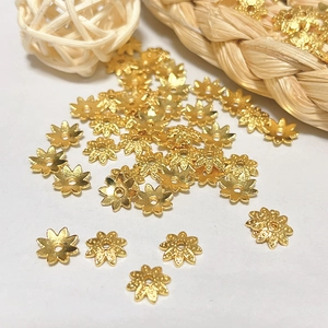 Macro shot of gold hollow petal bead caps for DIY jewelry making accessories