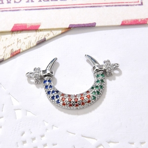 Macro detail of U-shaped jewelry connector with micro-set multi-colored zircon stones