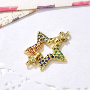 Detailed macro of gold star jewelry connector with multi-colored cubic zirconia stones