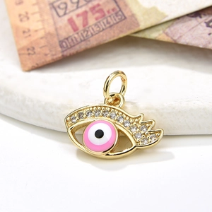 Pink evil eye charm pendant in gold finish with sparkling cubic zirconia inlay