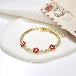 Bracciale tennis dorato con zircone, fiori in smalto rosso e dettaglio occhio di Allah