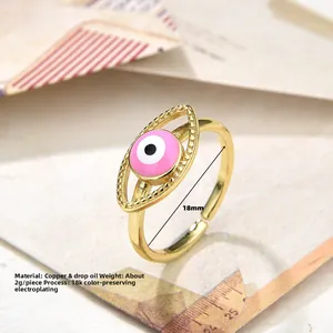 Macro view of vintage 18K gold plated pink evil eye ring with dimensions and weight info