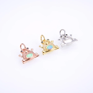 Three frog pendants in gold, rose gold and silver finish with opal and zircon settings