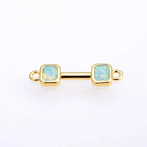 Detailed macro view of gold-plated dumbbell jewelry connector with opal inlay and dual loops