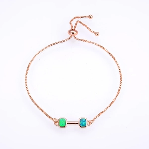Detail of rose gold adjustable box chain bracelet with green opal rectangle stones