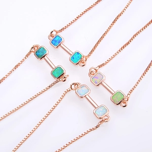 Dumbbell opal bracelet with rose gold box chain in four vibrant colors on white background