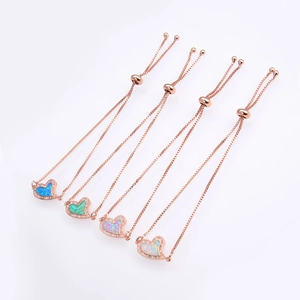 Detail view of heart opal bracelets in four colors with rose gold adjustable box chains