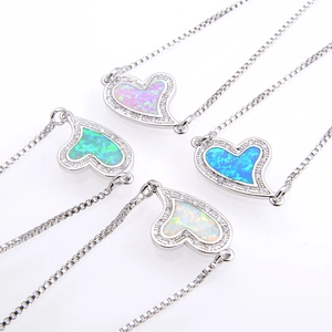 Gold-plated heart opal bracelets in pink, green, blue, and white with micro-pave crystals