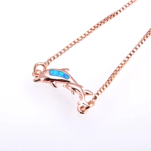 Rose gold dolphin pendant necklace with blue-green opal inlay and adjustable box chain