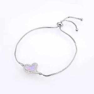 Detailed macro view of heart opal slider box chain bracelet with sparkling zirconia trim
