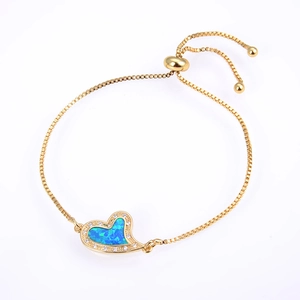 Adjustable golden box chain bracelet featuring a blue heart opal pendant with zircon halo