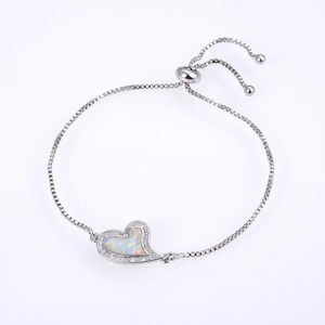 Detail of heart-shaped opal bracelet with bolo sliding clasp and box chain design