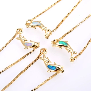 Adjustable golden dolphin bracelets with vibrant ocean opal stones and zircon accents
