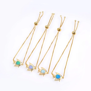 Detail of adjustable fish charm bracelets featuring vibrant multi-color opal gemstones