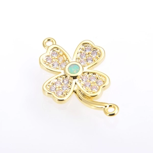 Detail of four-leaf clover connector with gold plating, opal center, and micro zircons